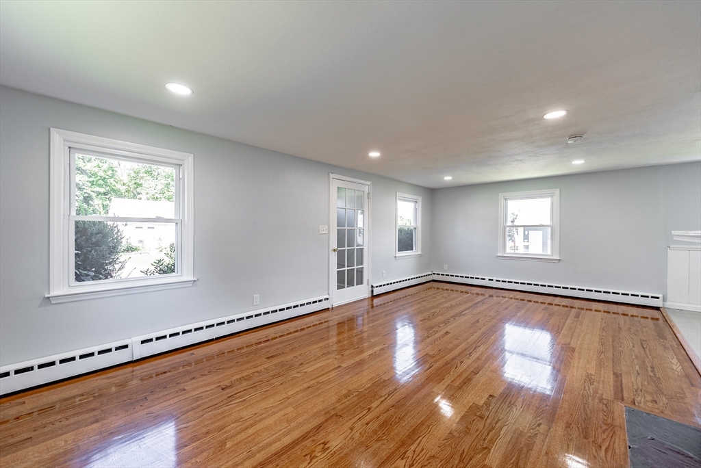 126 Lancaster Avenue West Springfield, MA 01089 - Photo 23 of 35 a view of an empty room with wooden floor and a window