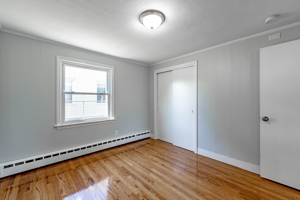 126 Lancaster Avenue West Springfield, MA 01089 - Photo 25 of 35 an empty room with wooden floor and windows