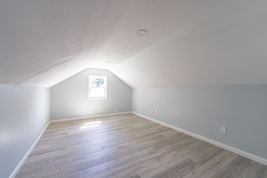126 Lancaster Avenue West Springfield, MA 01089 - Photo 28 of 35 an empty room with wooden floor and windows