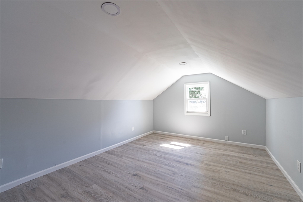 126 Lancaster Avenue West Springfield, MA 01089 - Photo 29 of 35 an empty room with wooden floor and windows