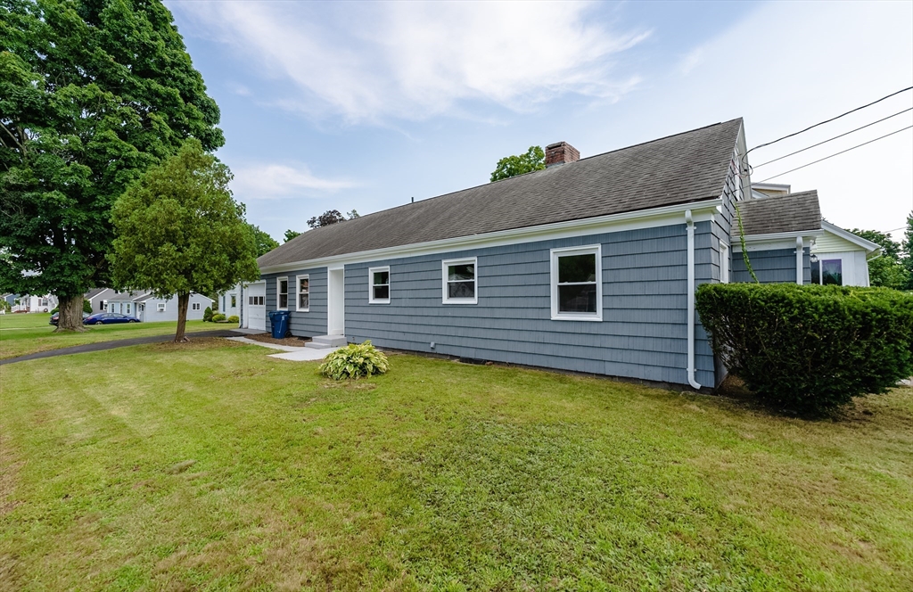 126 Lancaster Avenue West Springfield, MA 01089 - Photo 3 of 35 a backyard of a house with table and chairs