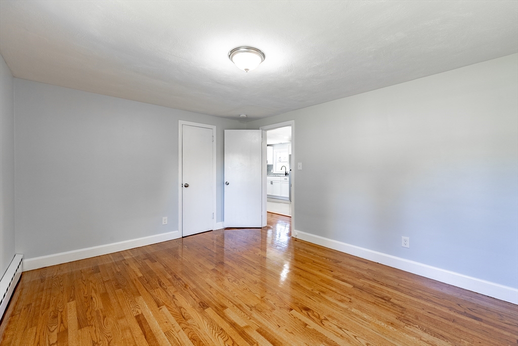 126 Lancaster Avenue West Springfield, MA 01089 - Photo 9 of 35 a view of empty room with wooden floor