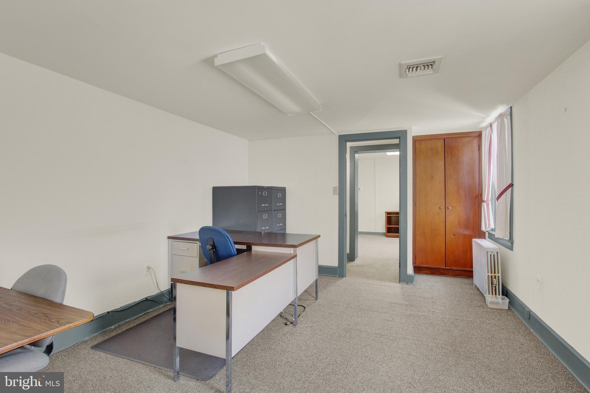 209 Broadway Hanover, PA 17331 - Photo 20 of 28 a living room with furniture and a flat screen tv