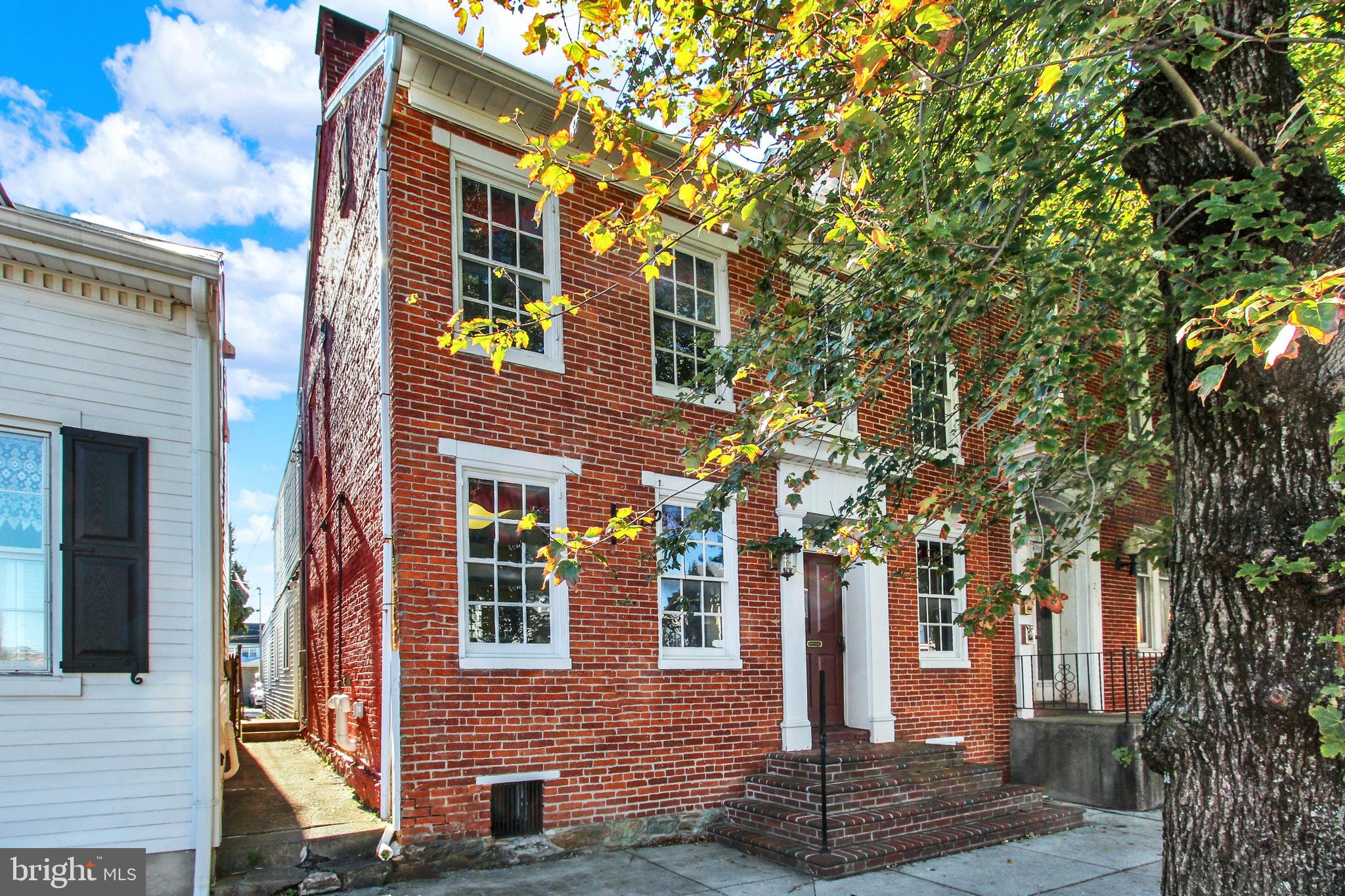 209 Broadway Hanover, PA 17331 - Photo 2 of 28 a front view of a house with a tree
