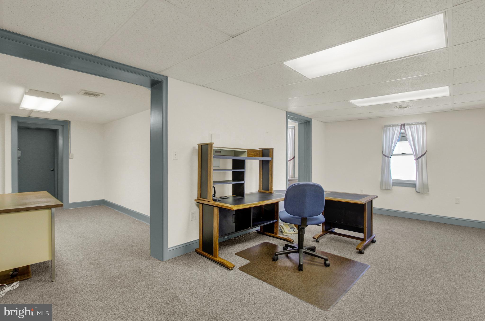 209 Broadway Hanover, PA 17331 - Photo 22 of 28 a view of a workspace with furniture and a window