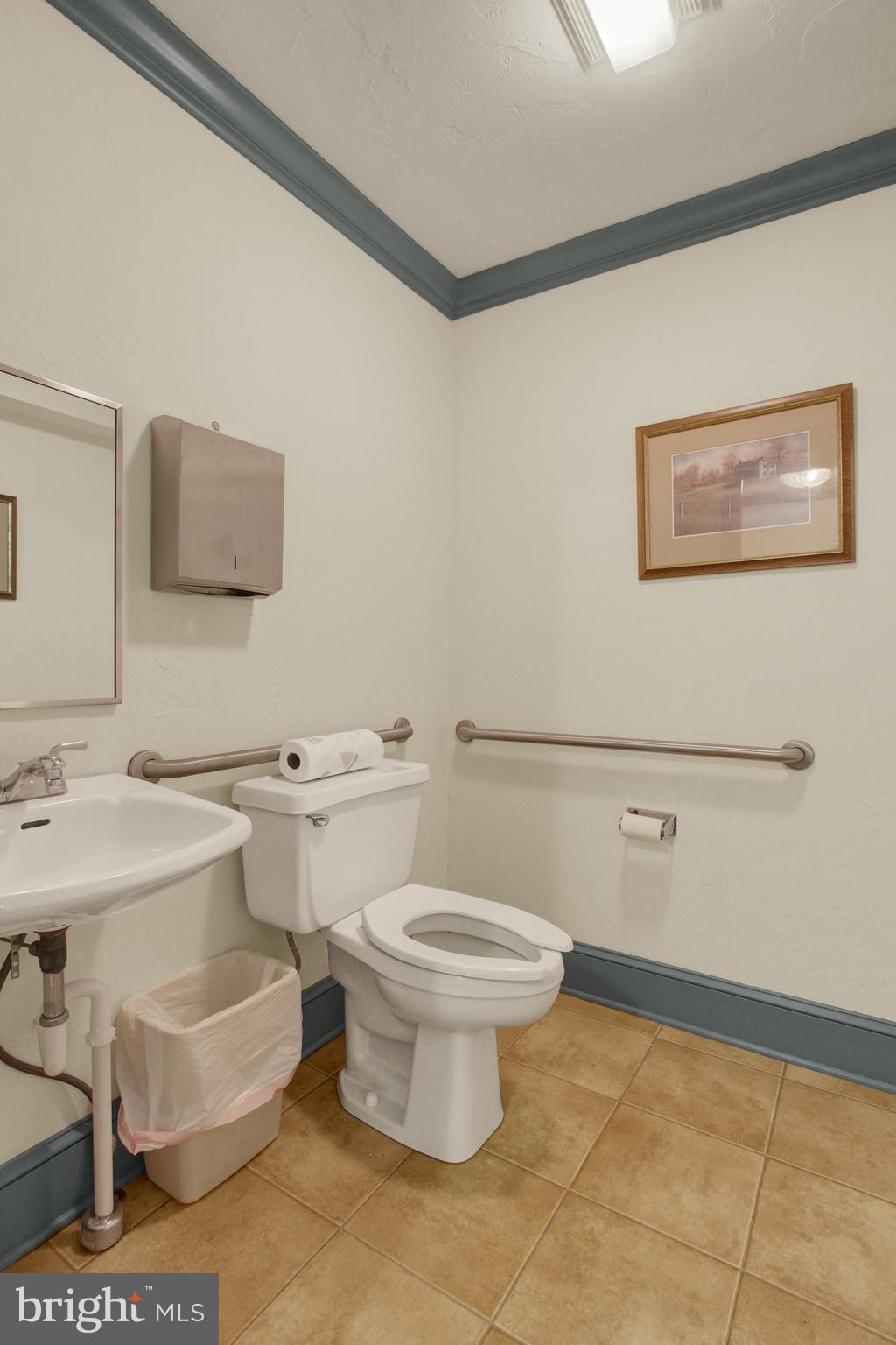 209 Broadway Hanover, PA 17331 - Photo 9 of 28 a bathroom with a toilet sink and mirror