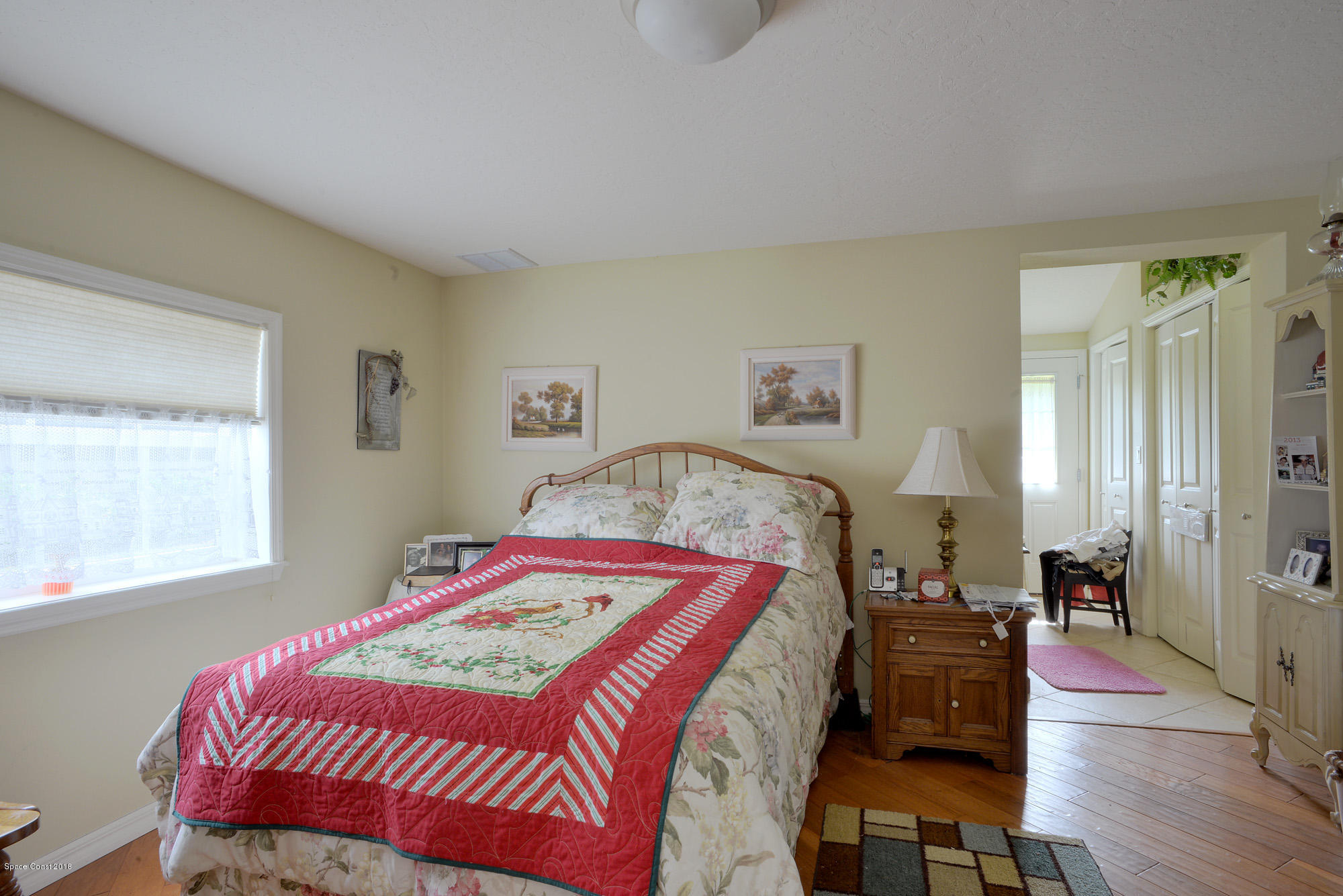 4107 Pinewood Road Melbourne, FL 32934 - Photo 22 of 32 a bedroom with bed and a window