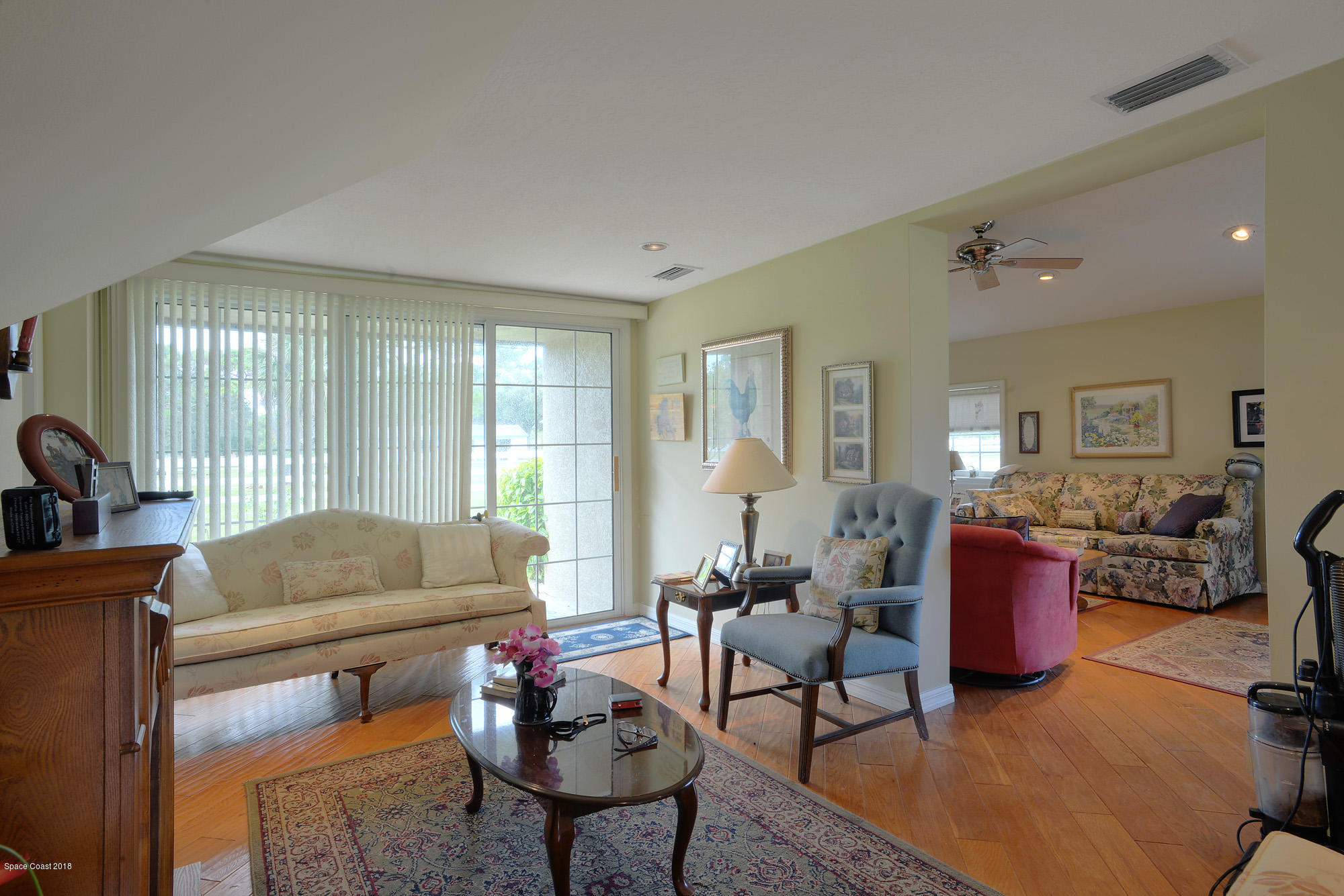 4107 Pinewood Road Melbourne, FL 32934 - Photo 24 of 32 a living room with furniture and a large window