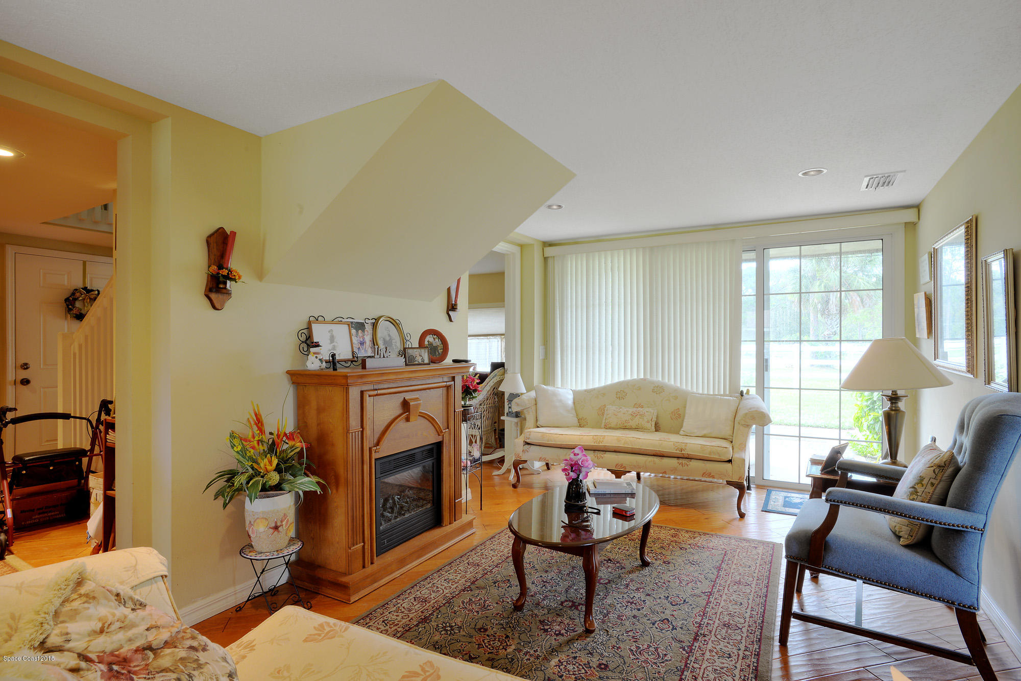 4107 Pinewood Road Melbourne, FL 32934 - Photo 25 of 32 a living room with furniture and a window