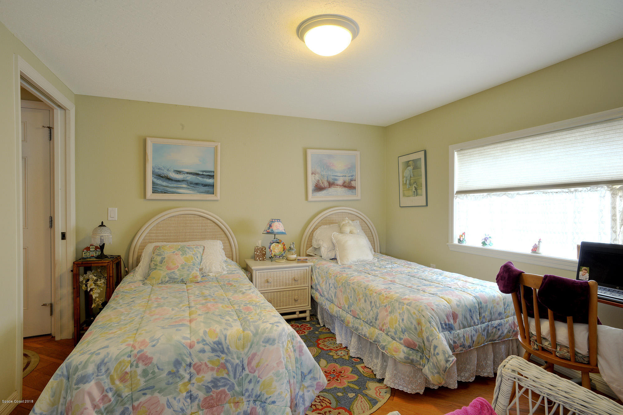 4107 Pinewood Road Melbourne, FL 32934 - Photo 28 of 32 a bedroom with bed and a window