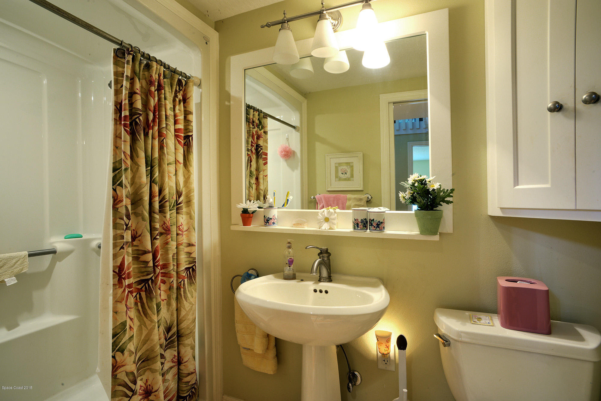 4107 Pinewood Road Melbourne, FL 32934 - Photo 29 of 32 a bathroom with a sink and a mirror