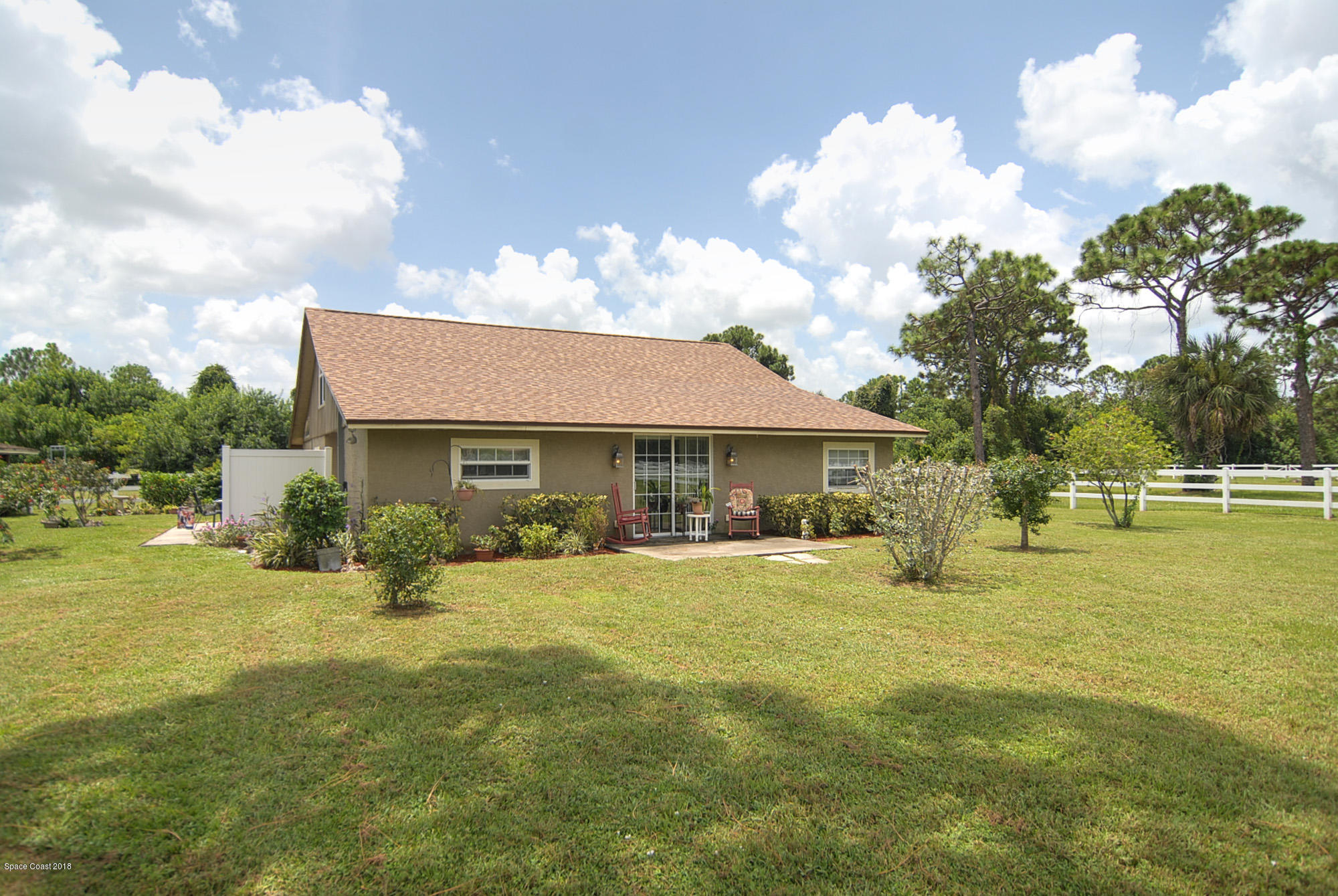 4107 Pinewood Road Melbourne, FL 32934 - Photo 30 of 32 a view of a house with a big yard