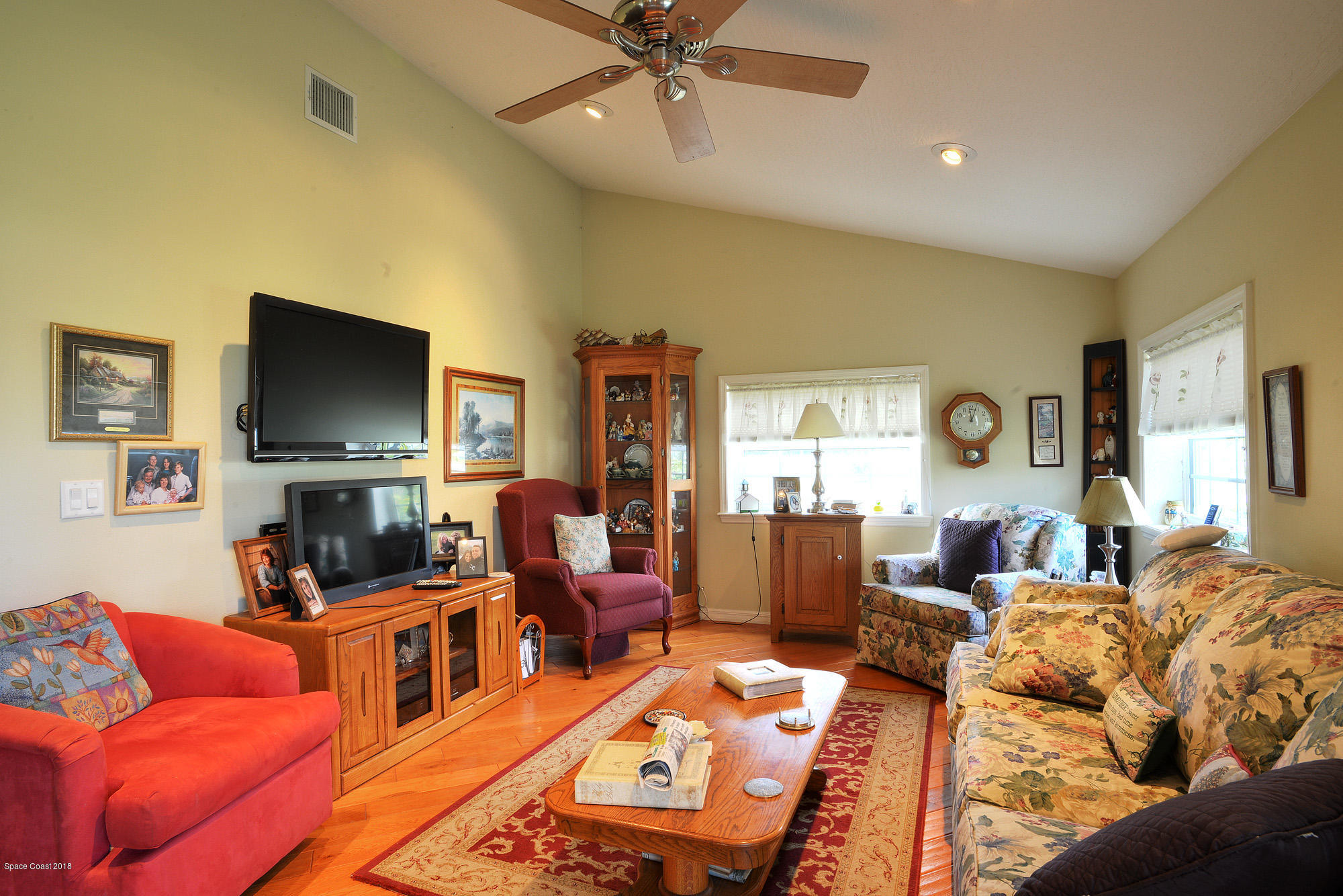 4107 Pinewood Road Melbourne, FL 32934 - Photo 31 of 32 a living room with furniture and a flat screen tv