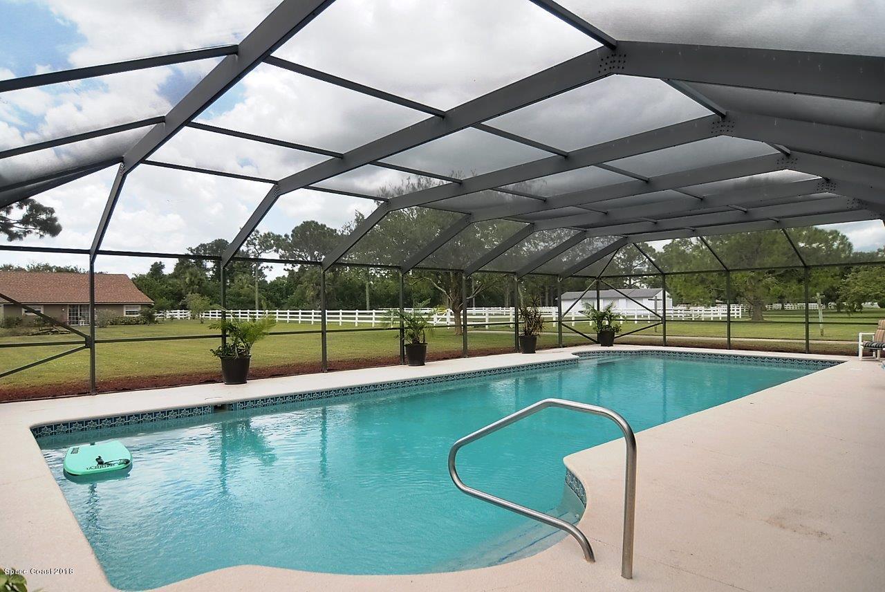 4107 Pinewood Road Melbourne, FL 32934 - Photo 9 of 32 a view of a swimming pool