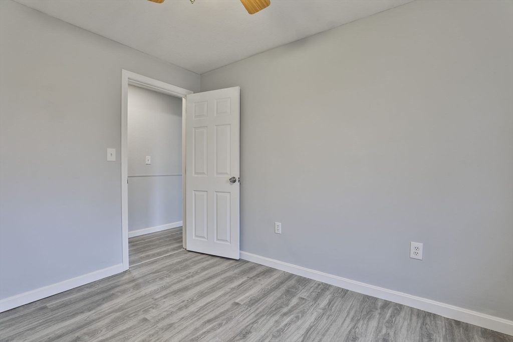 5 Norman Drive, Unit R Derry, NH 03038 - Photo 18 of 28 a view of room with wooden floor
