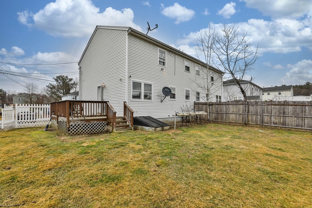 5 Norman Drive, Unit R Derry, NH 03038 - Photo 26 of 28 a view of a house with pool and a yard