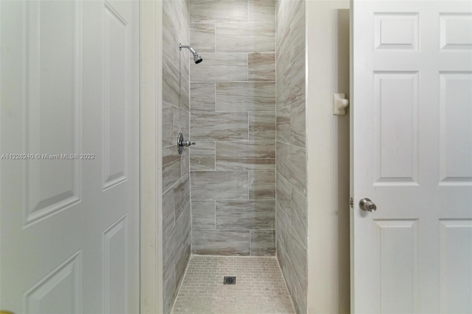 11451 Southwest 243 Terrace Homestead, FL 33032 - Photo 13 of 49 a bathroom with a shower