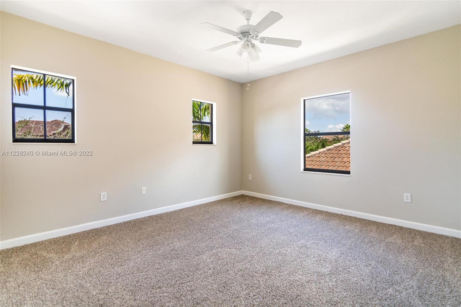 11451 Southwest 243 Terrace Homestead, FL 33032 - Photo 20 of 49 a view of an empty room with a window