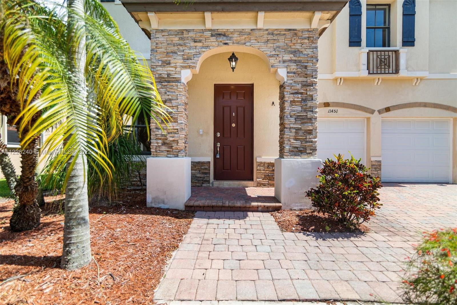 11451 Southwest 243 Terrace Homestead, FL 33032 - Photo 2 of 49 a front view of a house with a yard
