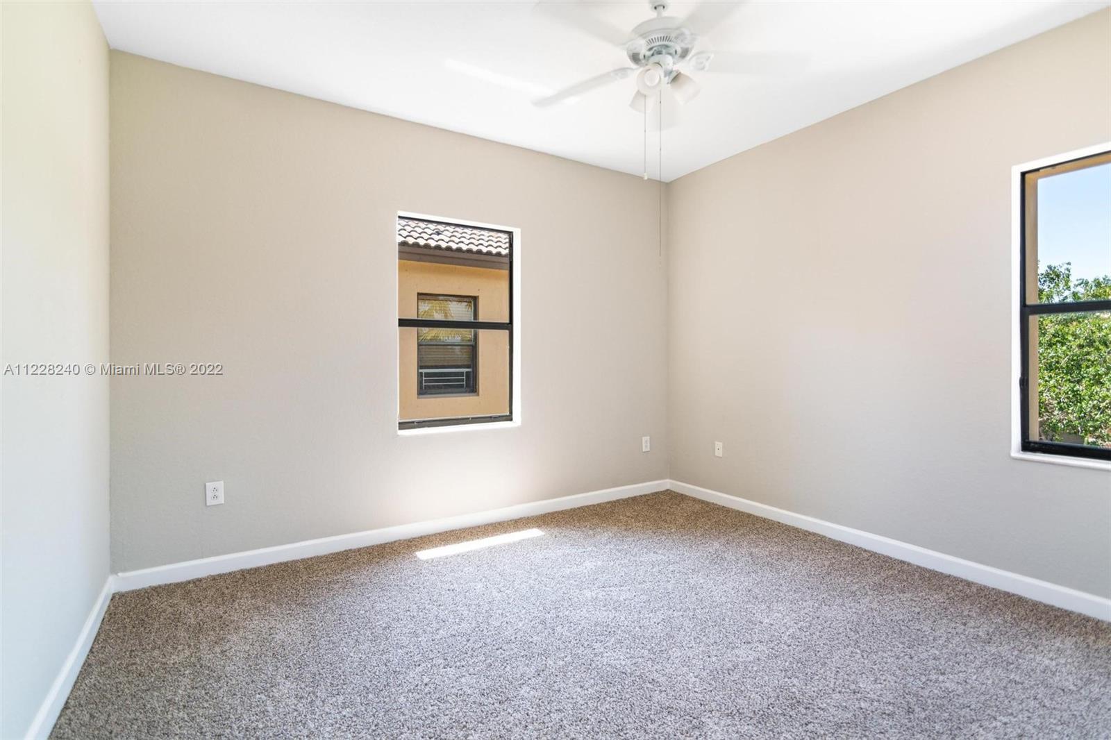 11451 Southwest 243 Terrace Homestead, FL 33032 - Photo 22 of 49 an empty room with a window