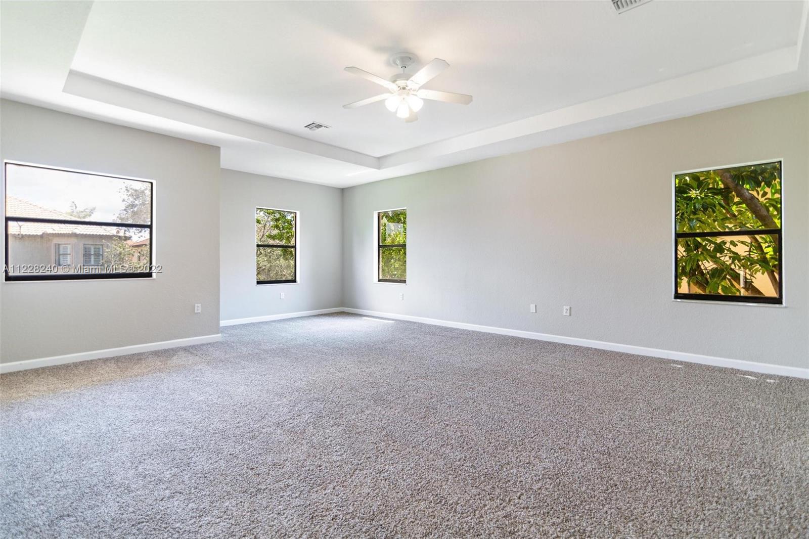 11451 Southwest 243 Terrace Homestead, FL 33032 - Photo 26 of 49 a view of an empty room with window and cabinet