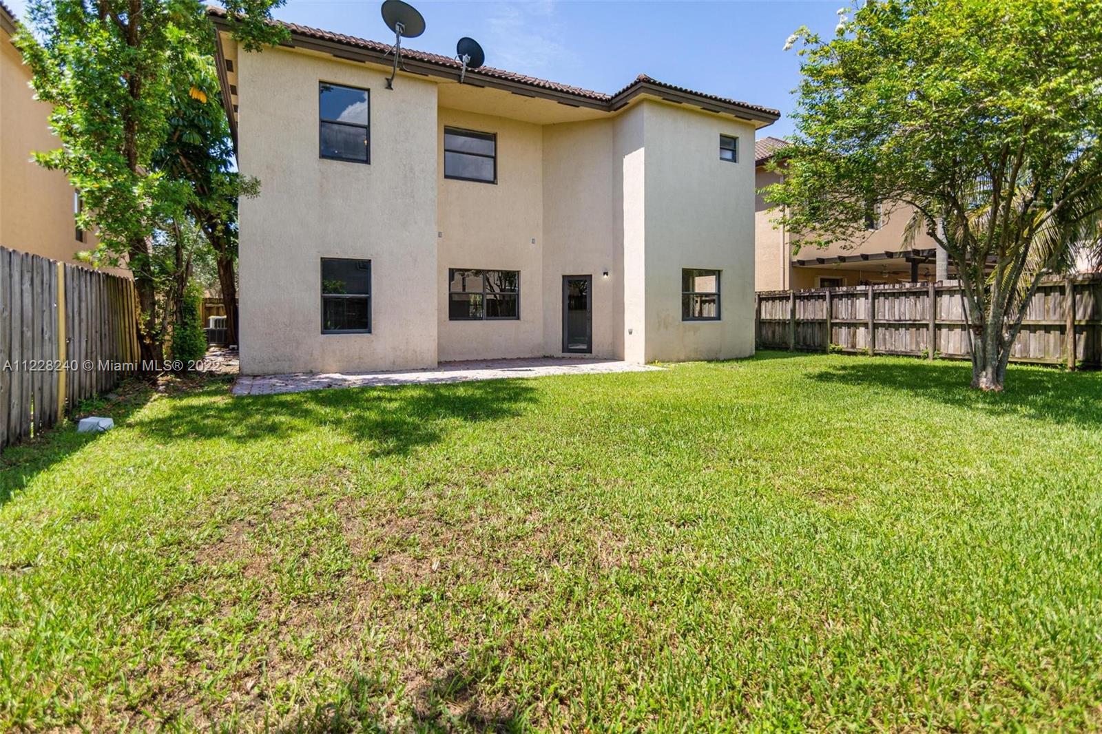 11451 Southwest 243 Terrace Homestead, FL 33032 - Photo 37 of 49 a view of a house with backyard and a tree