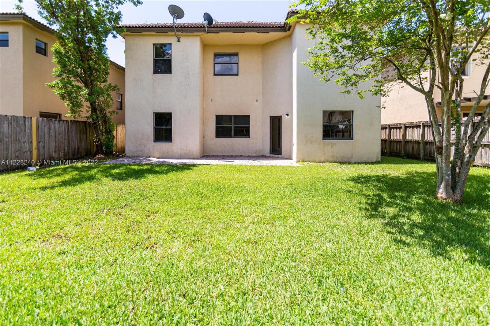 11451 Southwest 243 Terrace Homestead, FL 33032 - Photo 38 of 49 a view of a house with a yard