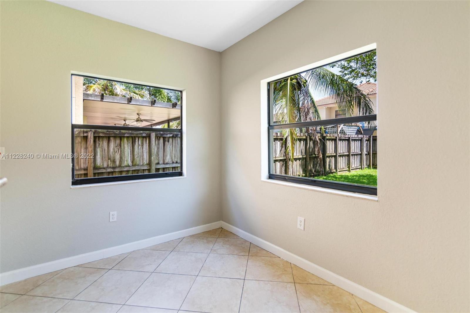 11451 Southwest 243 Terrace Homestead, FL 33032 - Photo 10 of 49 a view of an empty room with windows