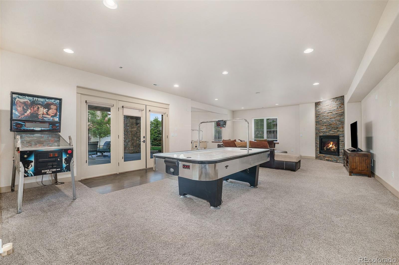 5792 Yank Street Arvada, CO 80002 - Photo 26 of 40 a living room with furniture and a fireplace