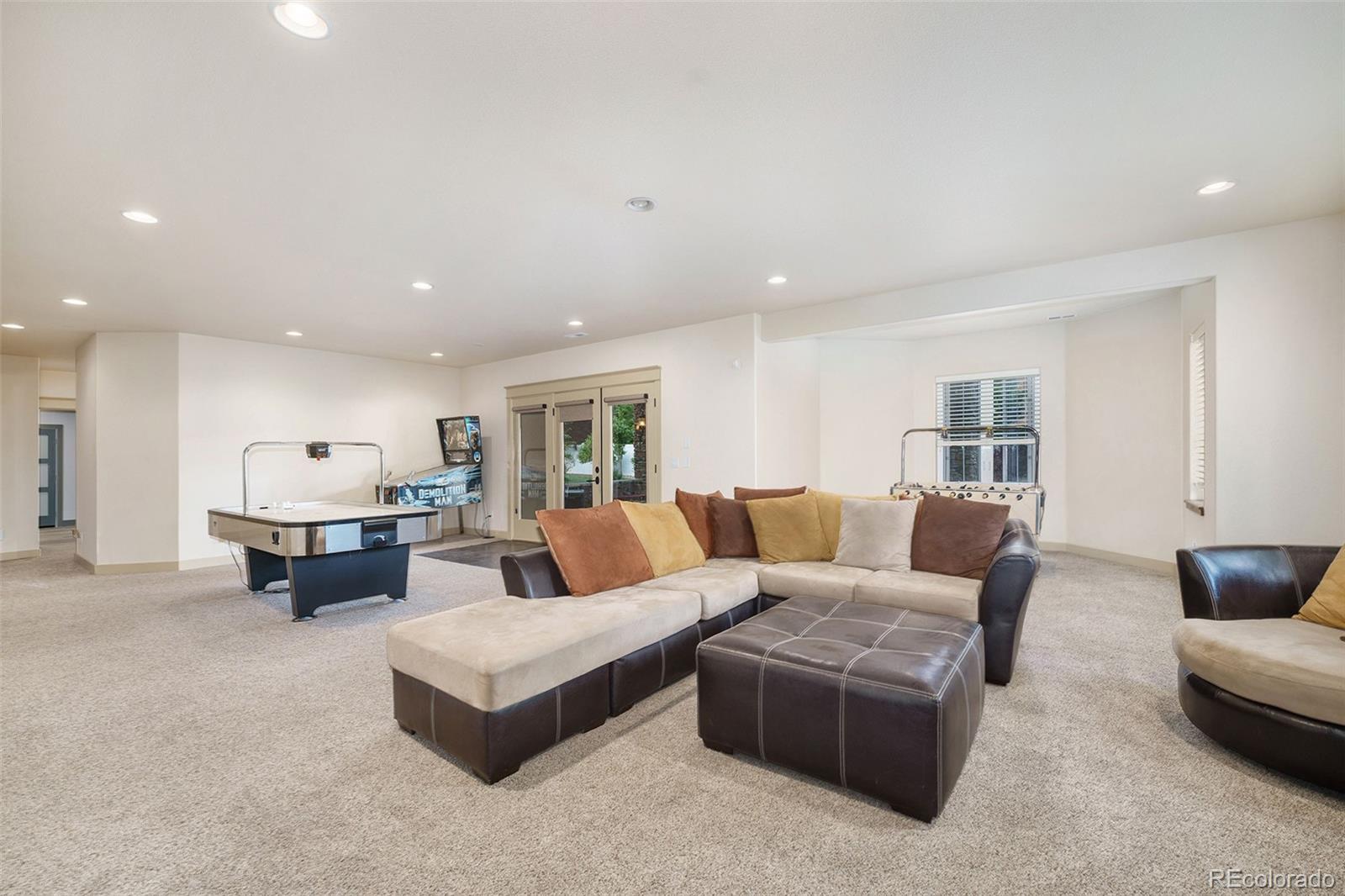 5792 Yank Street Arvada, CO 80002 - Photo 28 of 40 a living room with furniture and a couch
