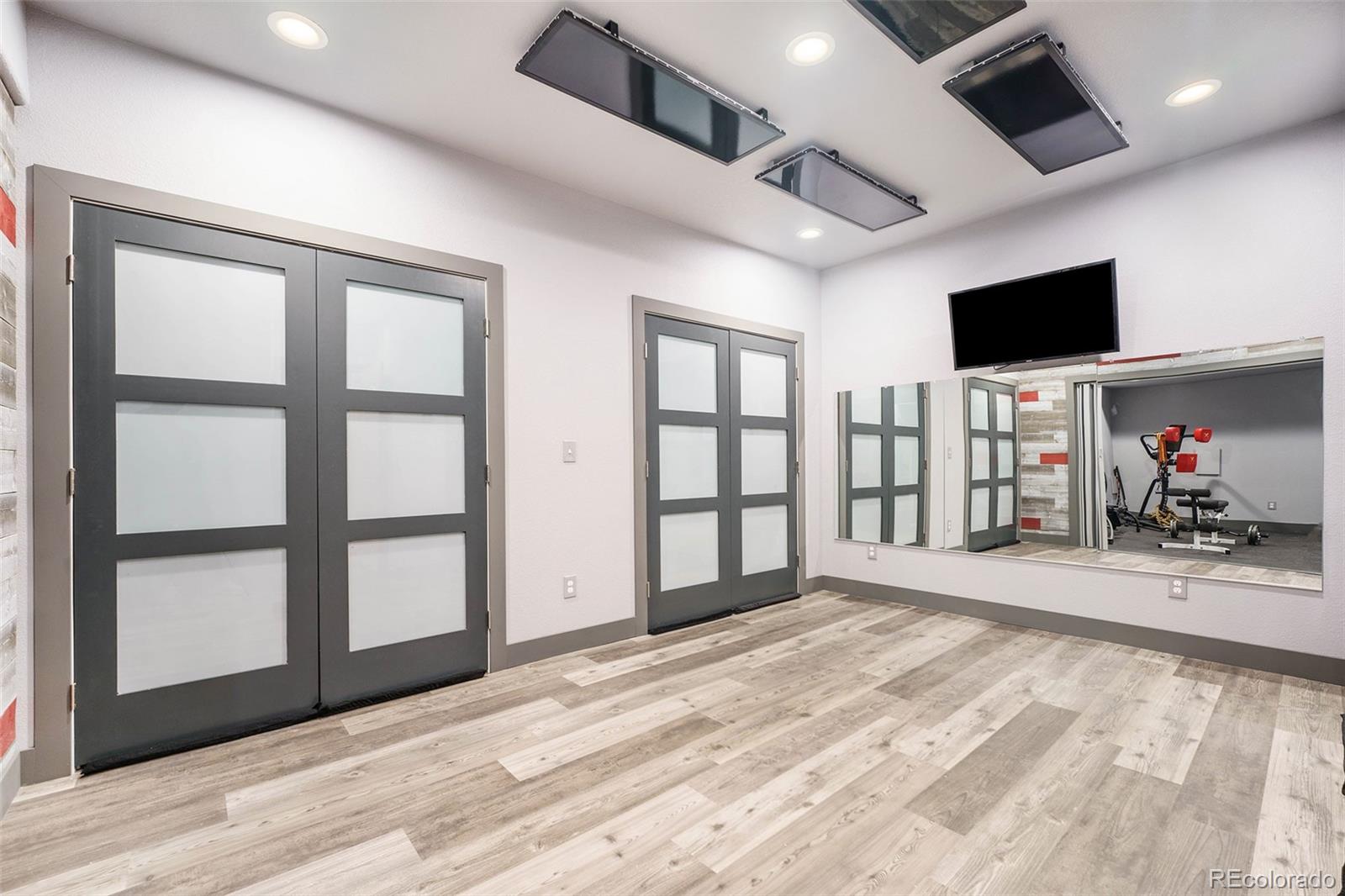 5792 Yank Street Arvada, CO 80002 - Photo 31 of 40 a view of a livingroom with a flat screen tv