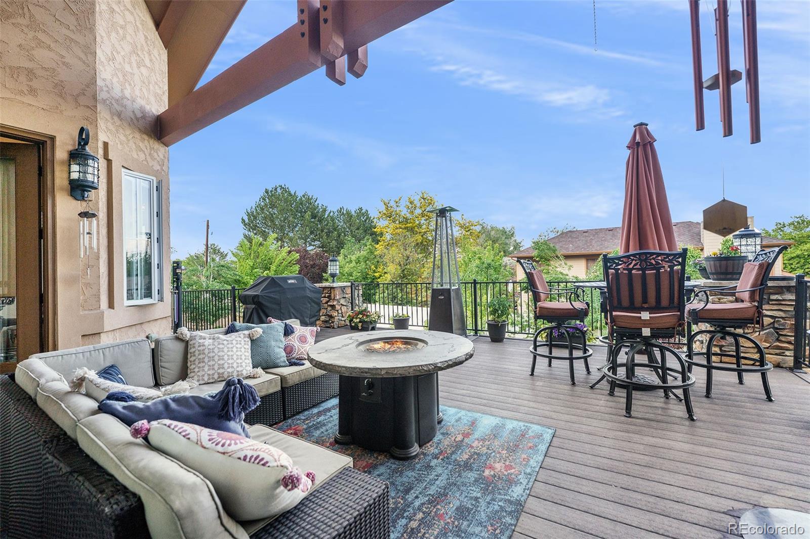 5792 Yank Street Arvada, CO 80002 - Photo 38 of 40 a view of a dining room with furniture and wooden floor