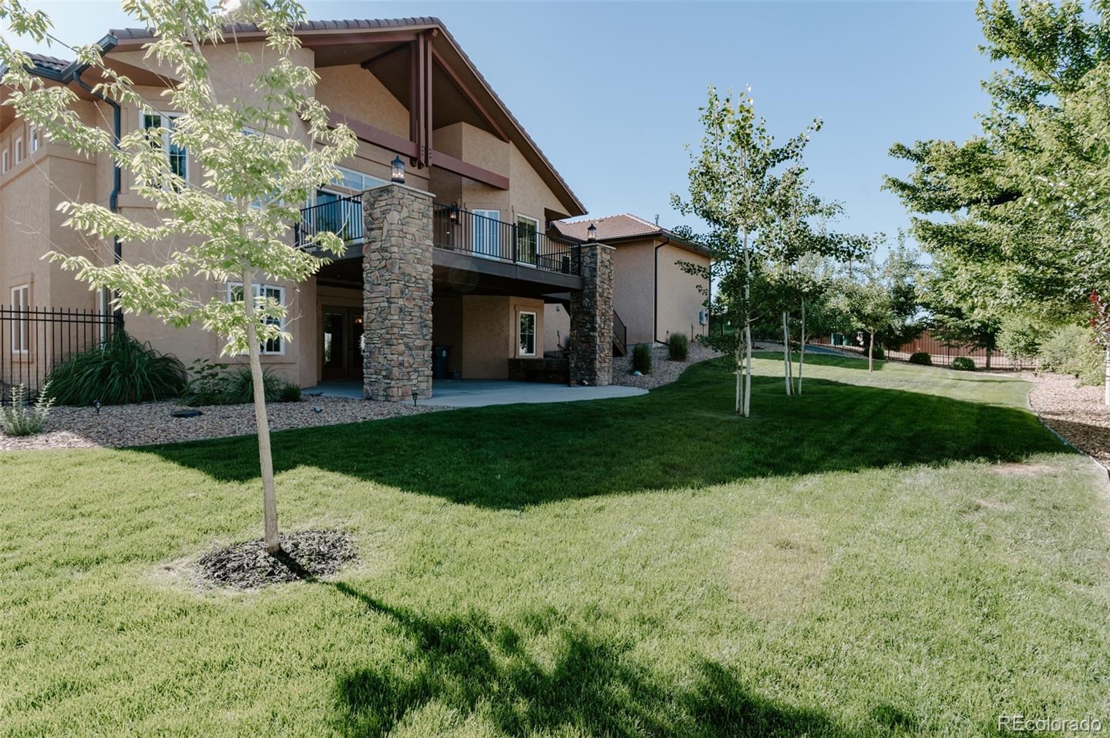 5792 Yank Street Arvada, CO 80002 - Photo 40 of 40 a house with garden in front of it