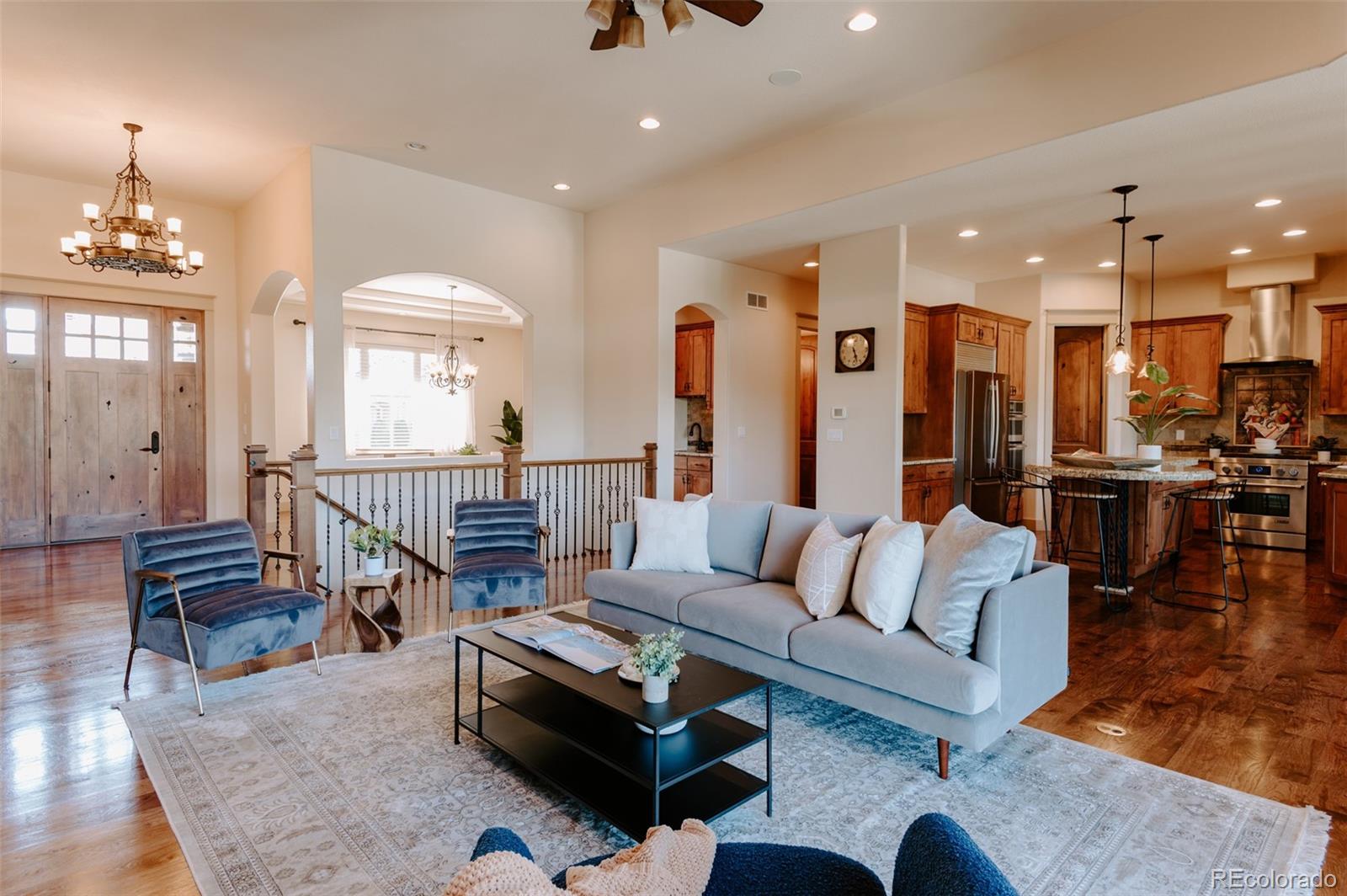 5792 Yank Street Arvada, CO 80002 - Photo 7 of 40 a living room with furniture and a dining table