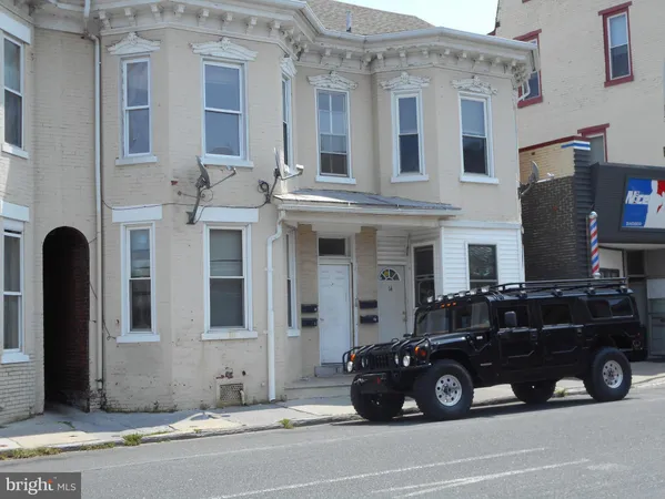 a black car parked in front of a building