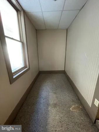 a view of a room with wooden floor and walls