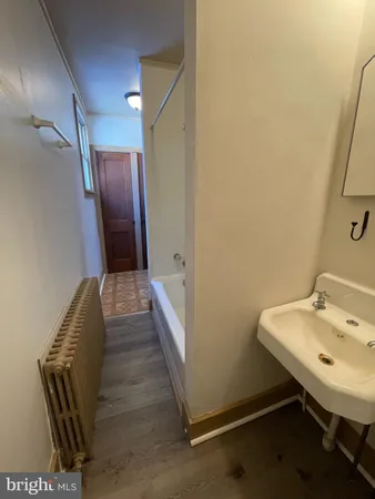 a kitchen with sink a refrigerator and window