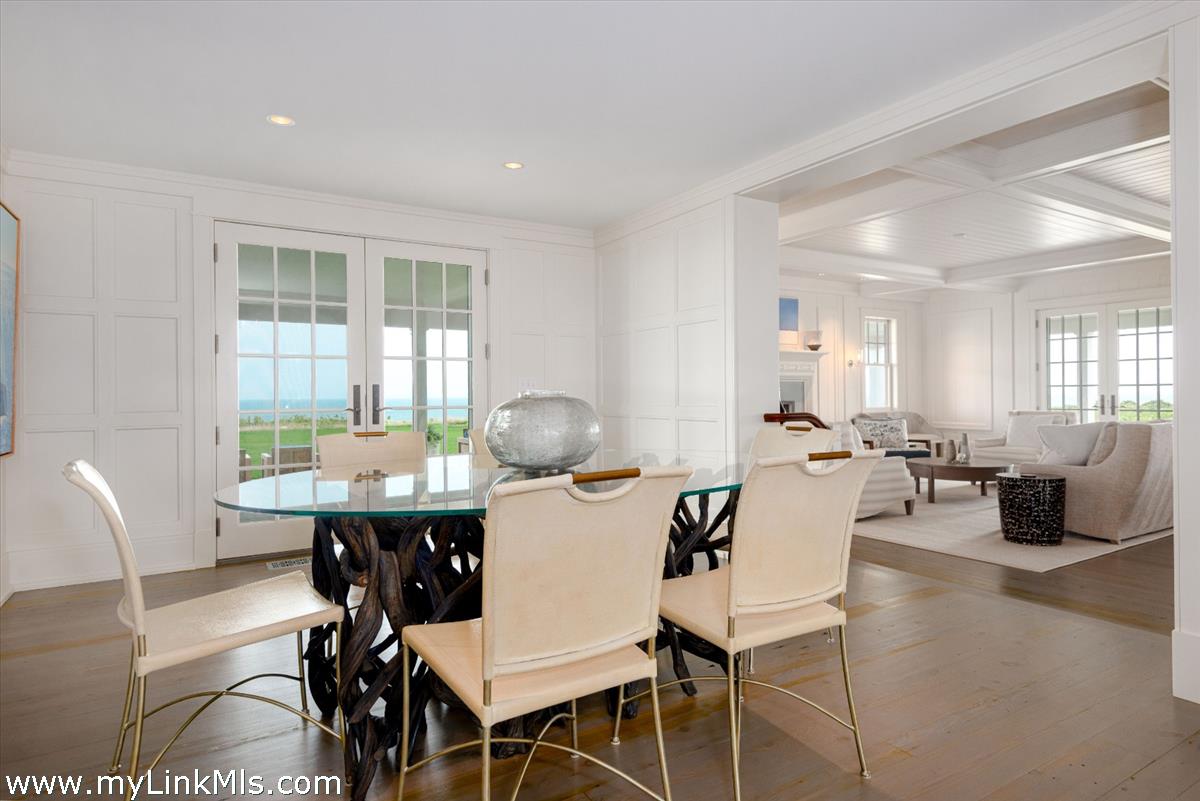 37 Sankaty Head Road Nantucket, MA 02554 - Photo 18 of 65 a view of a dining room with furniture and wooden floor