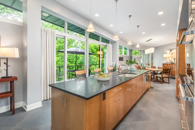 a bedroom with a bed and large window with outer view