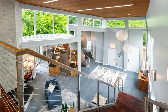 a large bathroom with a tub sink and glass door