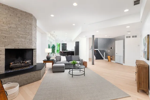 a spacious bedroom with a bed and a window