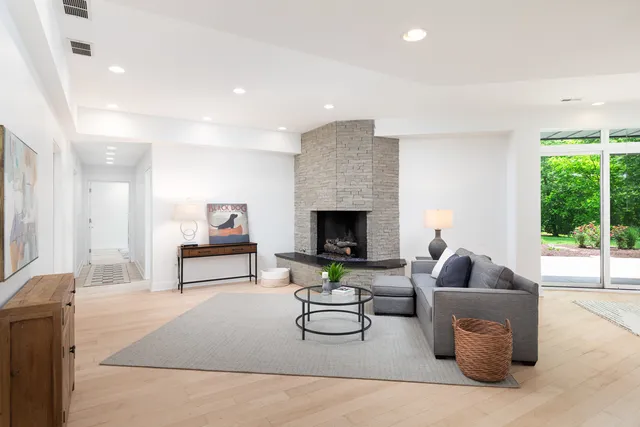 a bathroom with a tub double vanity sink and mirror