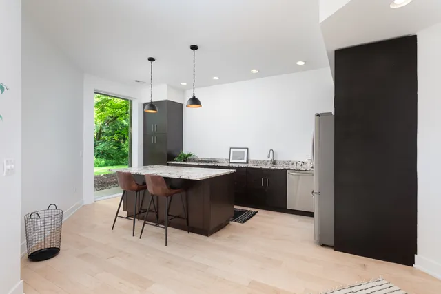a bathroom with a double vanity sink toilet and shower