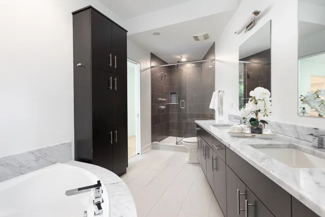 a spacious bedroom with a bed and a table in it