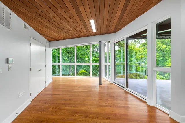 a view of a backyard with a garden and entertaining space