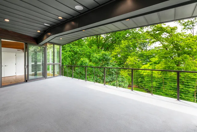 an aerial view of a house with a yard basket ball court and outdoor seating