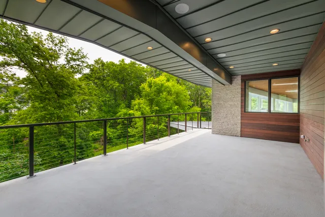 a aerial view of a house with swimming pool and garden