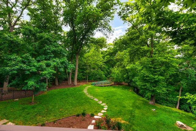 an aerial view of a house with yard swimming pool and outdoor seating
