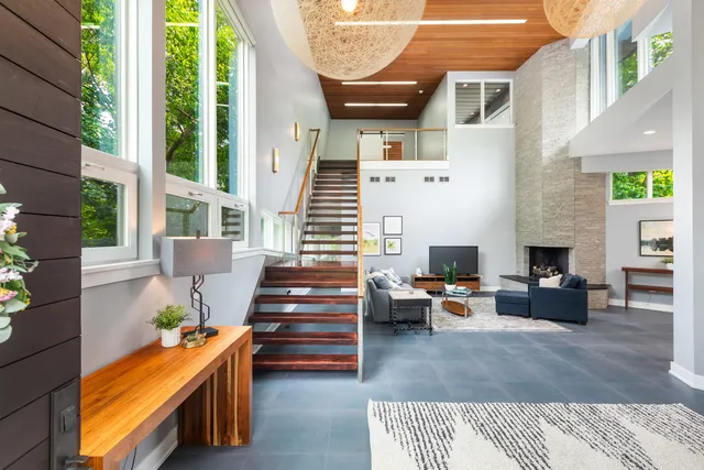 a backyard of a house with outdoor seating