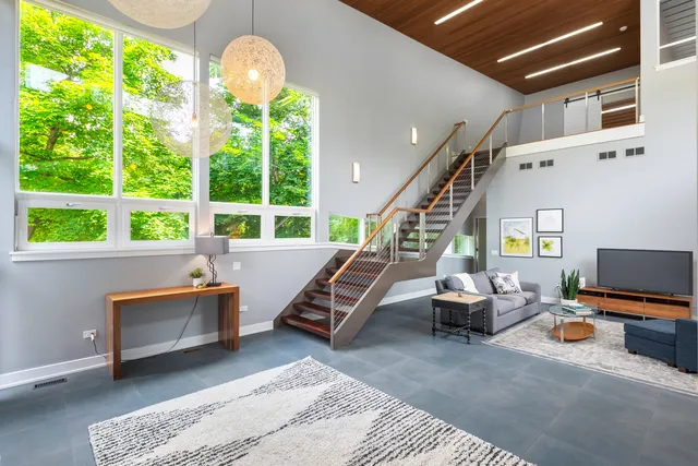 a living room with furniture a air conditioner and windows